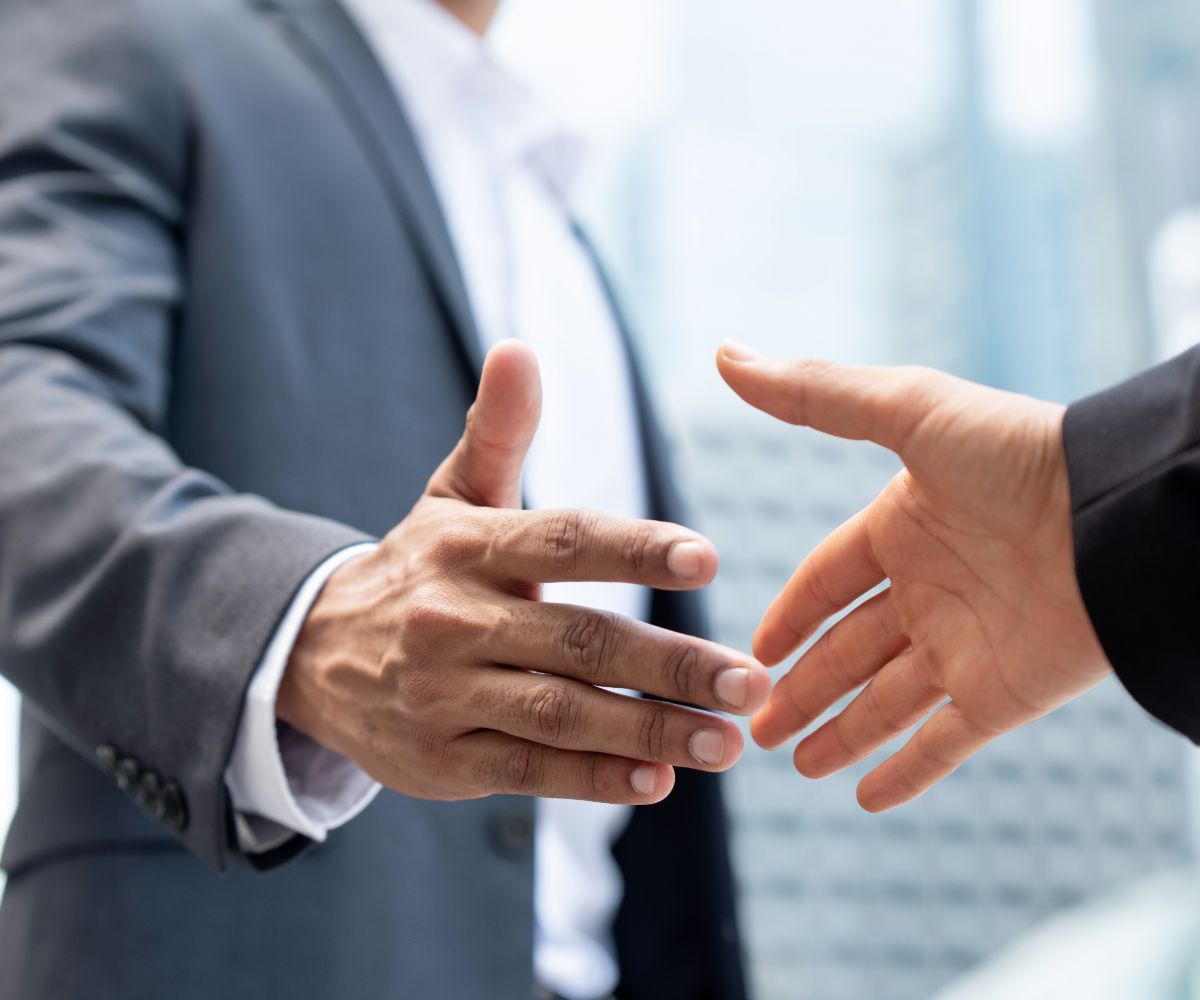 two people about to shake hands